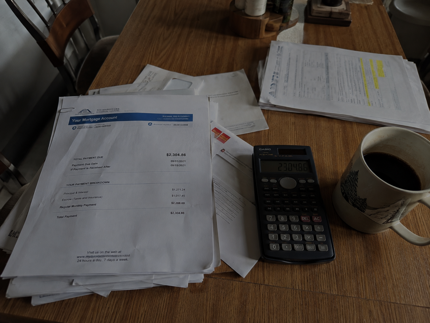 Financial stress caused by in laws asking for money on a kitchen table