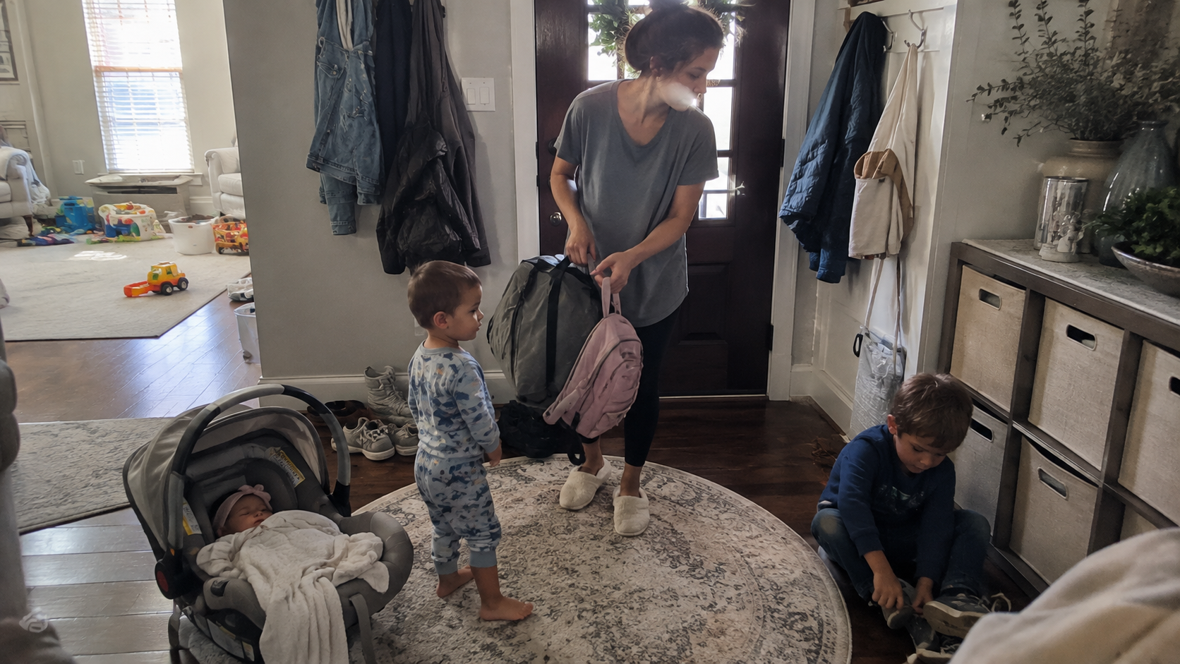 A single mother of three getting her children ready to leave home on a busy morning.