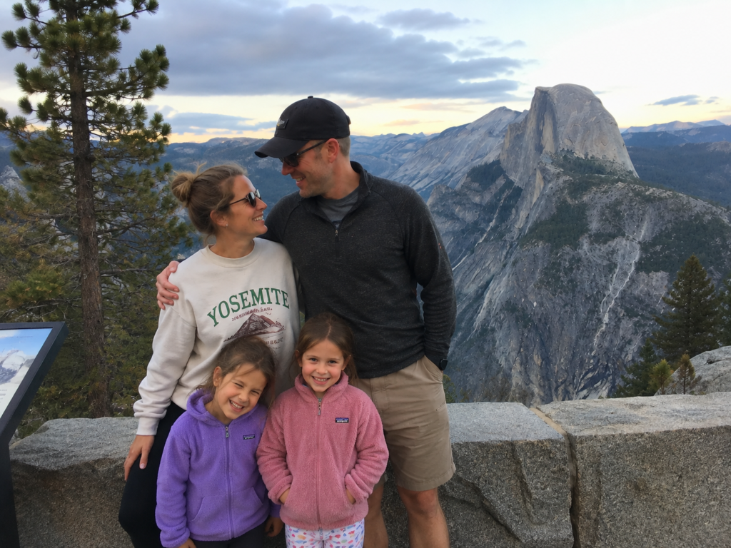A family of four with two young daughters enjoying a vacation amid pressure to have another baby.
