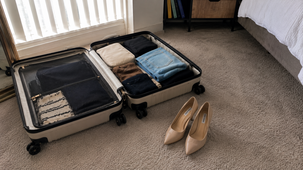 Weekend suitcase beside work essentials symbolizing not ready for marriage after 5 years