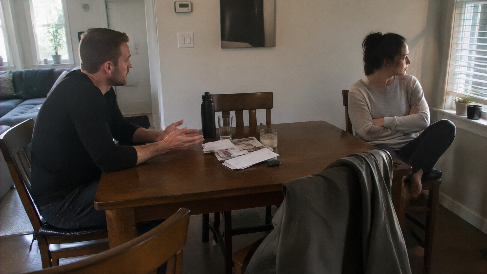 prenup disagreement couple arguing over financial terms at home table