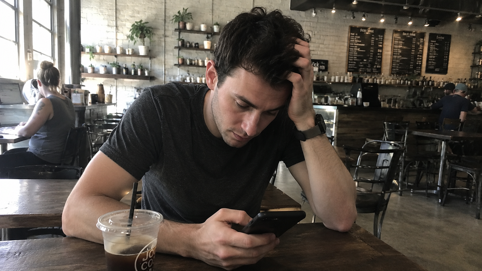 A guy looking thoughtful while dealing with unrealistic relationship expectations in modern dating